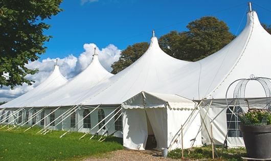 a line of sleek and modern portable toilets ready for use at an upscale corporate event in East Norwich